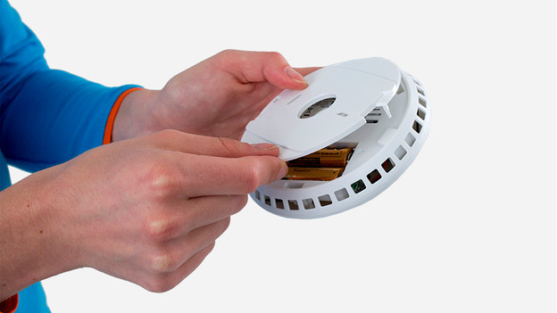 Replace the batteries or the smoke detector hatch