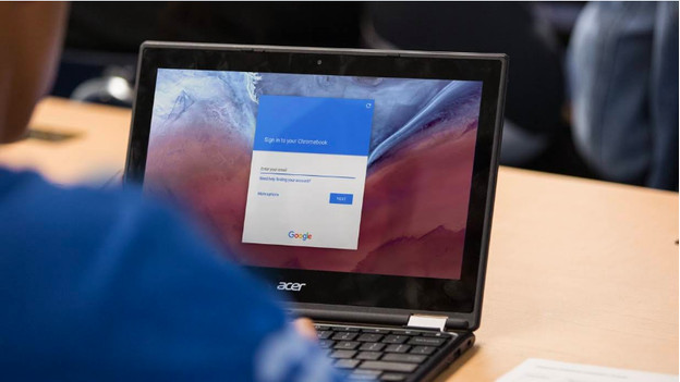 Child works on a Chromebook