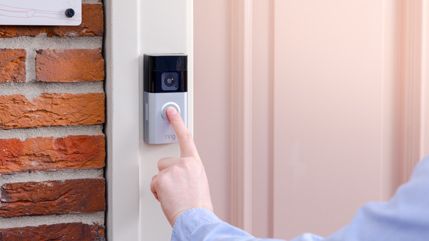 Ring doorbell hangs next to the door