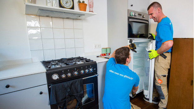 Place the front panel on the fridge door