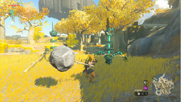 Link uses Fuse to make a hammer from a branch and a rock and he attacks enemies.