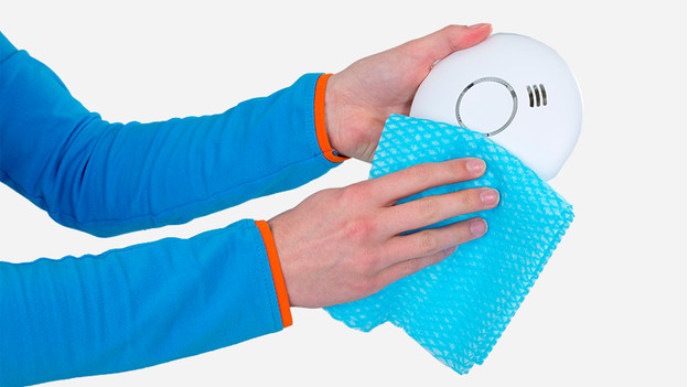 Cleaning smoke detector with cloth