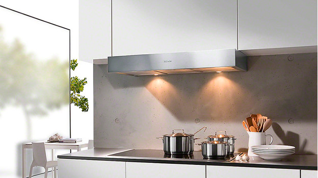 Under-cabinet range hood in a kitchen