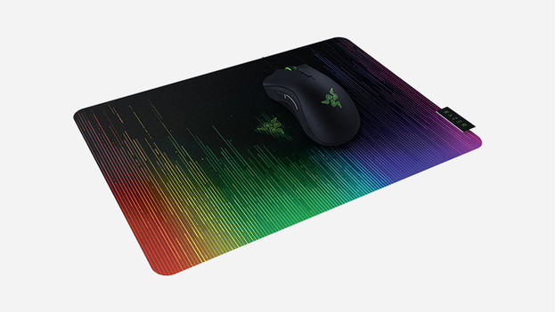 Gaming mouse on rainbow mousepad.