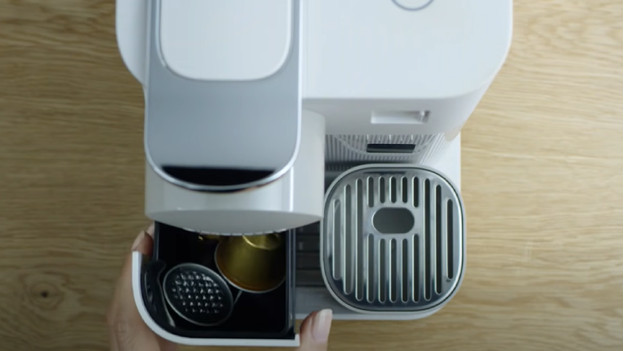 Empty the container for used coffee capsules