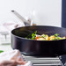 GreenPan Evolution High-sided skillet with lid 26cm Black product in use