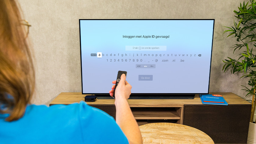 Vul de Apple ID gegevens in van de persoon die je wil toevoegen