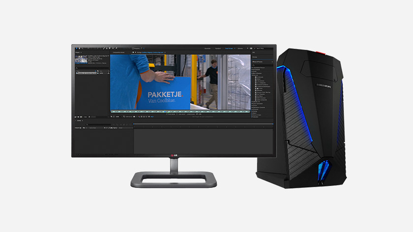 Ordinateur avec écran et Adobe Premiere Pro sur l'écran.