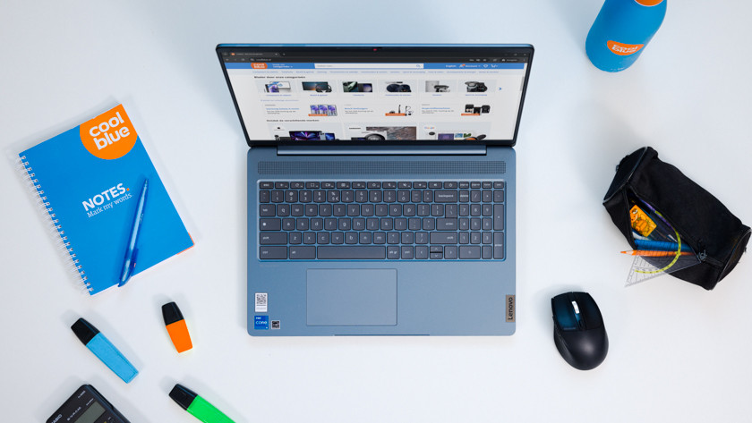 Chromebook with school supplies next to it