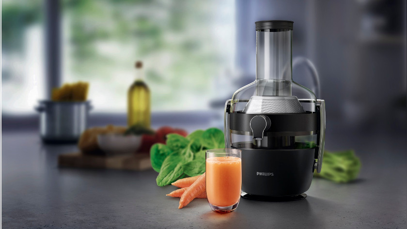 Juicer with carrots and juice