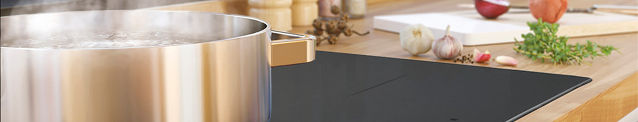 Which functions does an induction cooktop have?