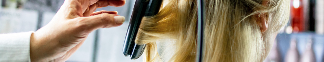 How do you create curls with a hair straightener?