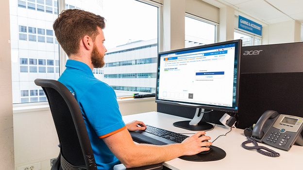 How do you adjust a monitor ergonomically