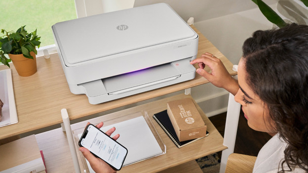 Woman at an HP printer.