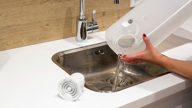 Condensreservoir legen