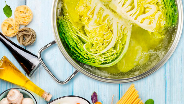 Cooking pot: vegetables. potatoes, and rice