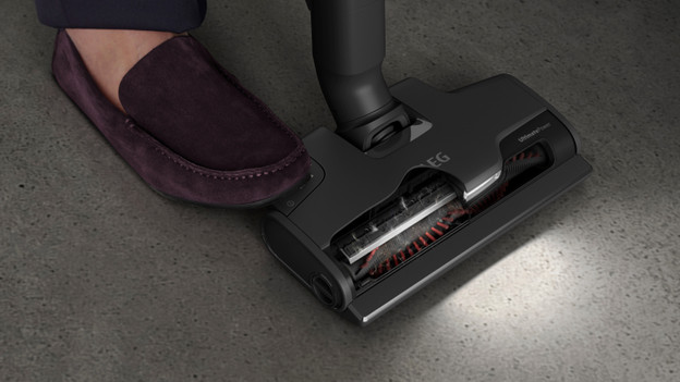 Vacuum with a self-cleaning brush