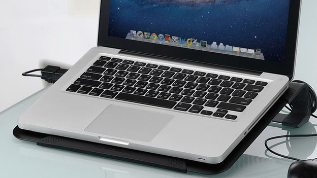 A laptop stand with active cooling and a MacBook