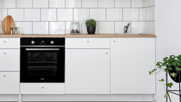 Kitchen with built-in oven and microwave