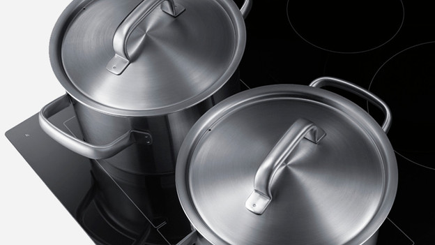 Two pans on a cooktop