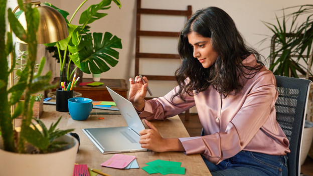 2-in-1 Chromebook where someone taps the screen.