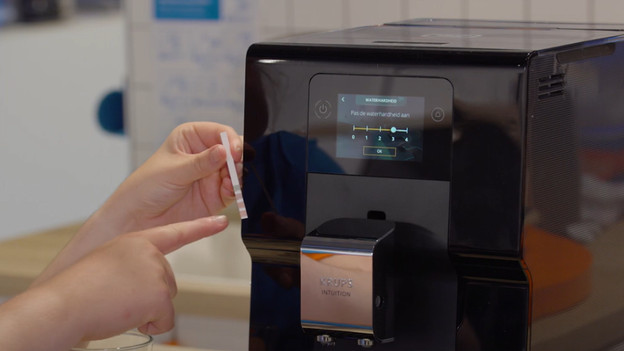 Stel de waterhardheid in