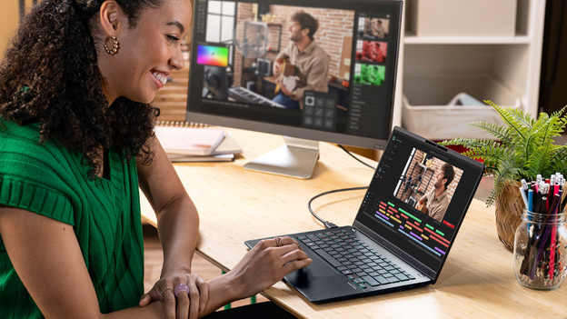 Person working with an ASUS laptop.