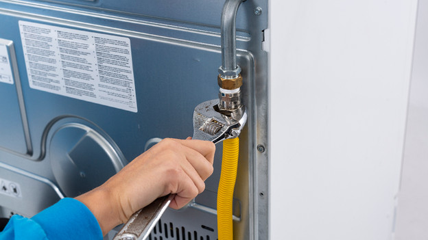 Connect the gas hose to the stove