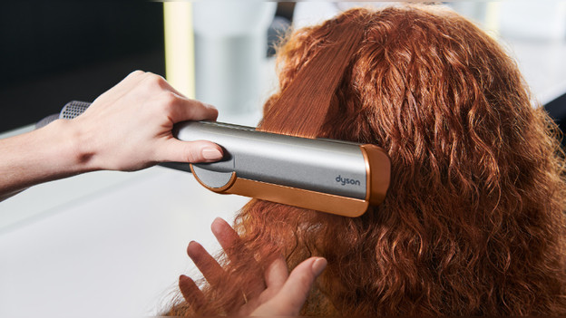 Dyson Airstrait straightening hair