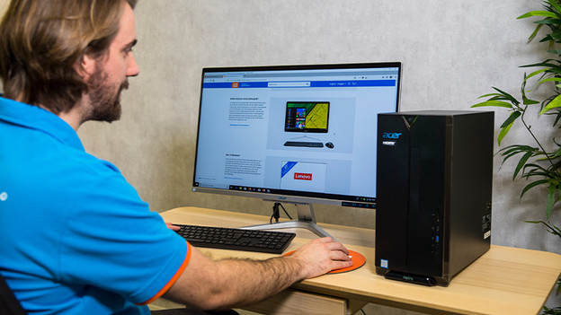 Person works on desktop.