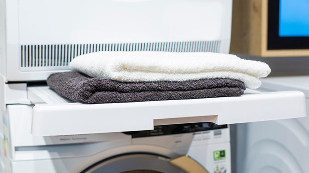 Place the dryer on your washing machine with a stacking kit