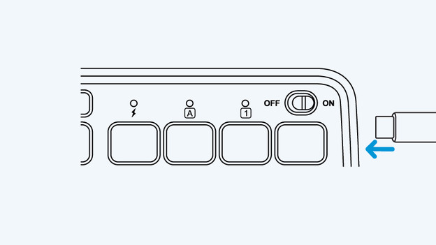 De oplaadport zit aan de rechterkant van het toetsenbord