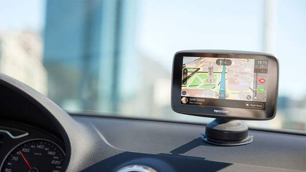 TomTom navigation system in mount on dashboard