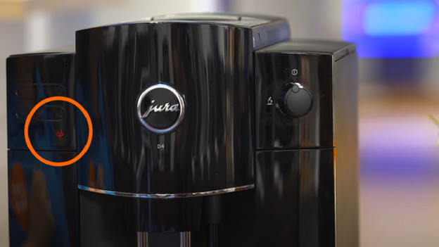 The machine is done as soon as the icon of the coffee grounds tray lights up