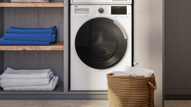 Washing machine with towels next to it