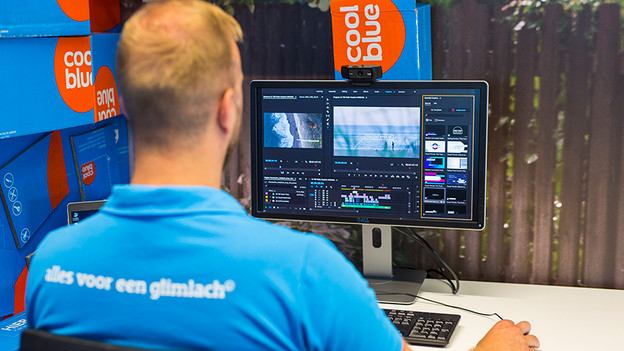 Someone behind a monitor with a tiltable webcam.