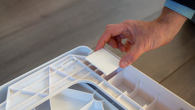 You place one white strip in each corner of the casing.