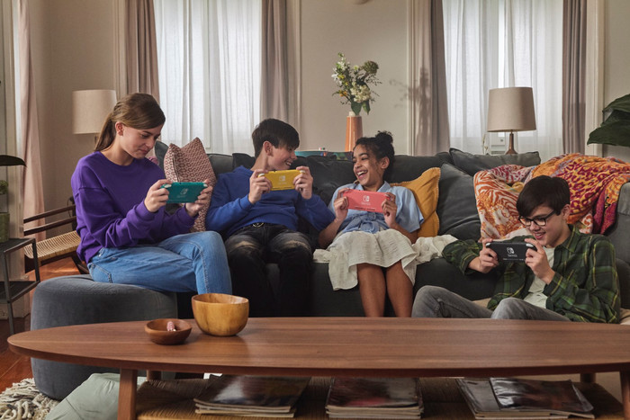 Nintendo Switch Lite Coral + Mario Kart 8 Deluxe Switch product in use