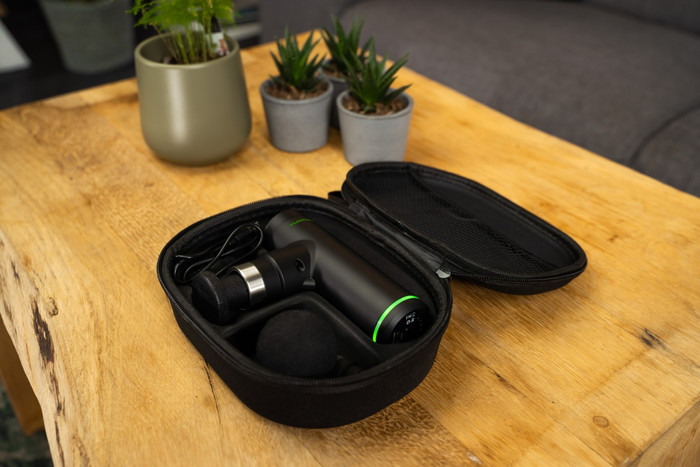 Tunturi Massage Gun Mini + Massage Head Warm and Cool product in use