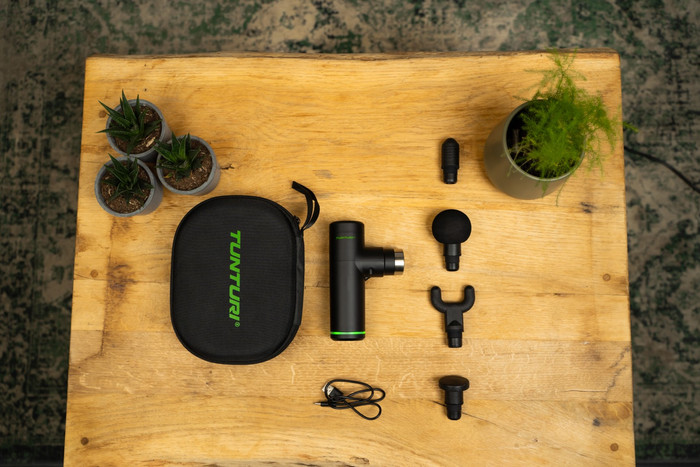 Tunturi Massage Gun Mini + Massage Head Warm and Cool product in use