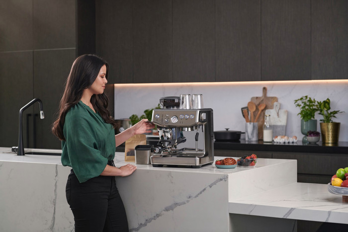 Sage Barista Express Impress Brushed Stainless Steel + Knock Box product in use