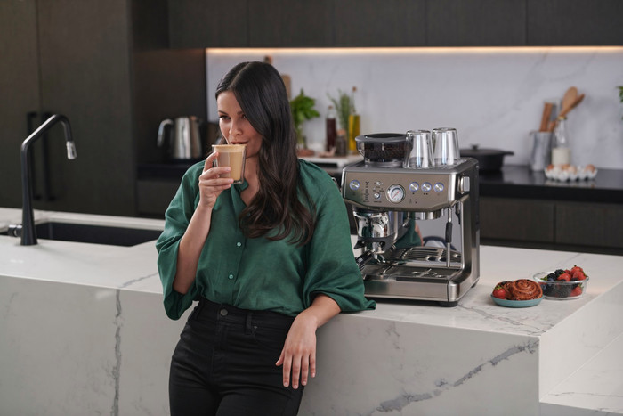 Sage Barista Express Impress Brushed Stainless Steel + Knock Box product in use