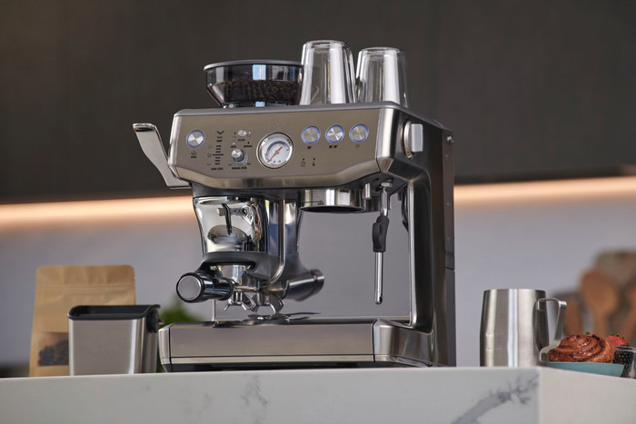 Sage Barista Express Impress Brushed Stainless Steel + Knock Box product in use