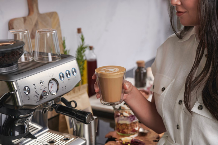 Sage Barista Express Impress Brushed Stainless Steel + Knock Box product in use