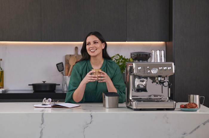 Sage Barista Express Impress Brushed Stainless Steel + Knock Box product in use