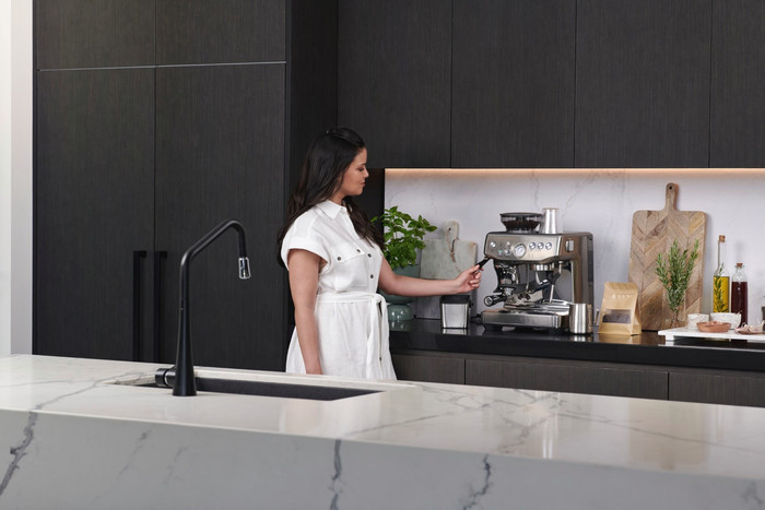 Sage Barista Express Impress Brushed Stainless Steel + Knock Box product in use