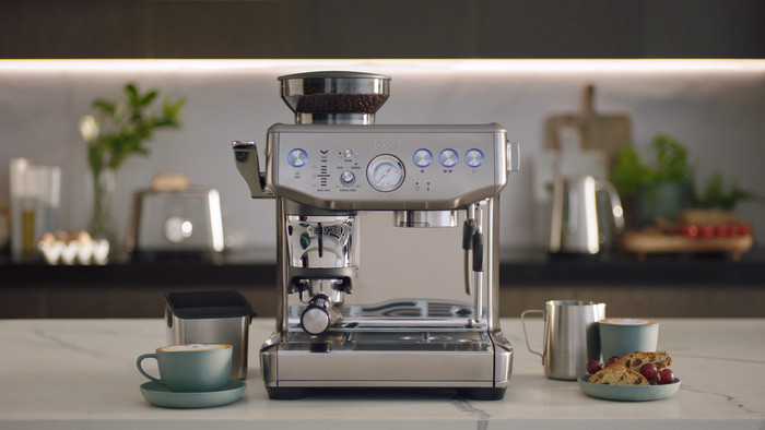 Sage Barista Express Impress Brushed Stainless Steel + Knock Box product in use