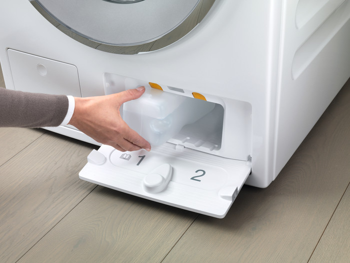Miele dispenser TwinDos Care product in gebruik