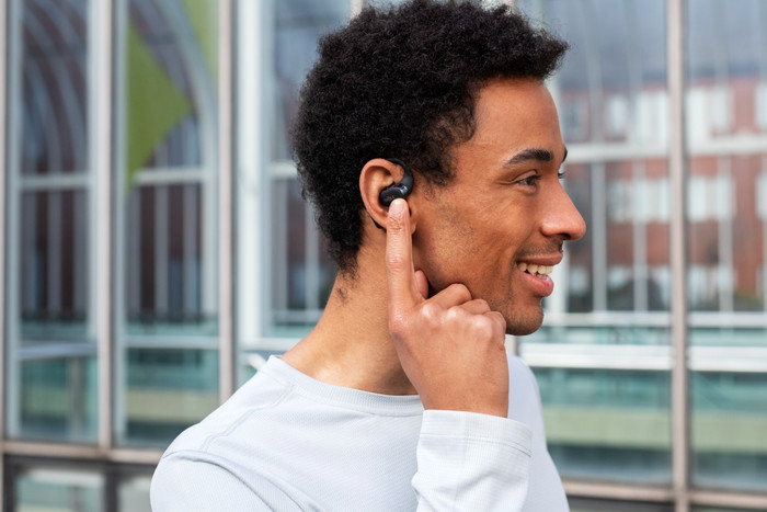 Shokz OpenFit Cream product in use