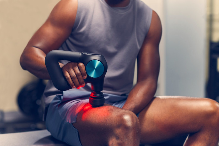 Theragun Pro + product in use